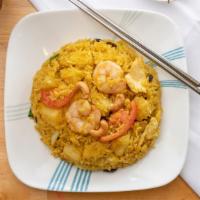 Pineapple Fried Rice · Shrimps, chicken, pineapples, cashew, raisins, onions, bell peppers with a hint of curry pow...