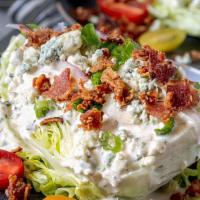 Wedge Salad · Gluten-free. Heirloom tomatoes, red onion, apple wood bacon, egg, blue cheese.