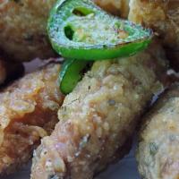 Salt And Pepper Wings · 5 pieces. Deep fried crispy battered wings, sautéed with salt and pepper seasoning.