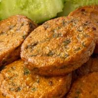 Thai Fish Cakes · 8 pieces of ground fish patties mixed with thai red curry, and sliced green beans. Fried and...