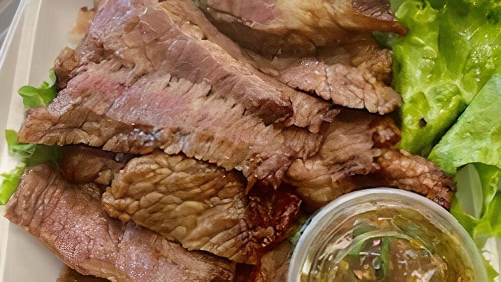 Bbq Beef · Beef brisket marinated in our special house marinade grilled, sliced, and served with our homemade chili, lime and cilantro sauce.