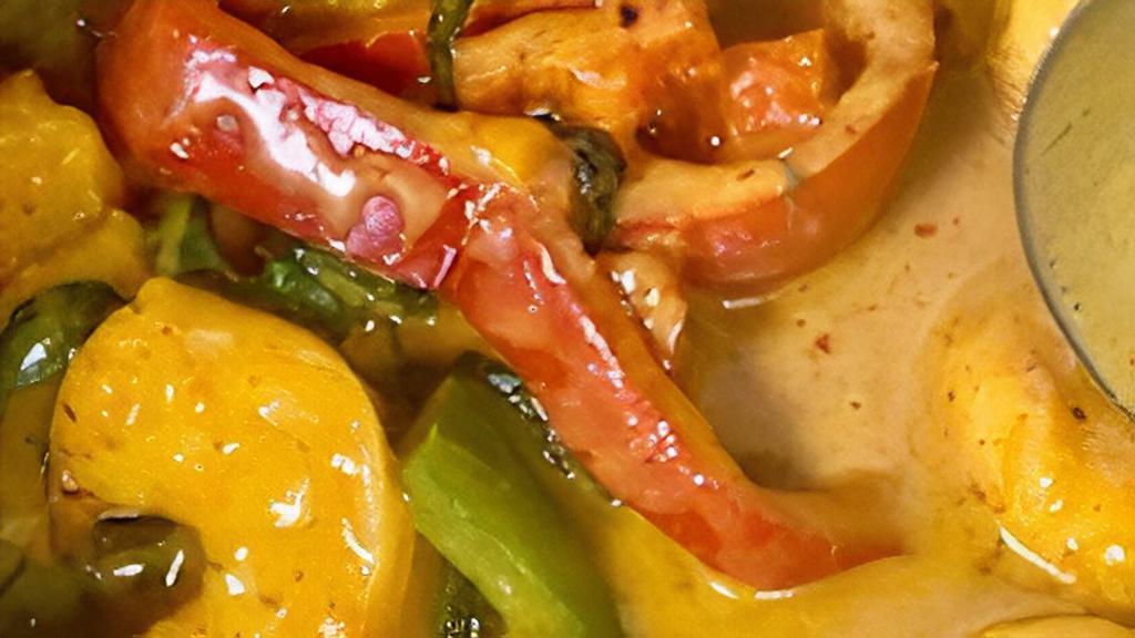 Panang Curry · Coconut curry prepared with a special Thai panang curry paste, bell peppers, and basil.