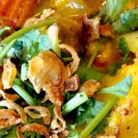 Yellow Curry · Yellow coconut curry prepared with potatoes and carrots. Topped with fresh cilantro and frie...