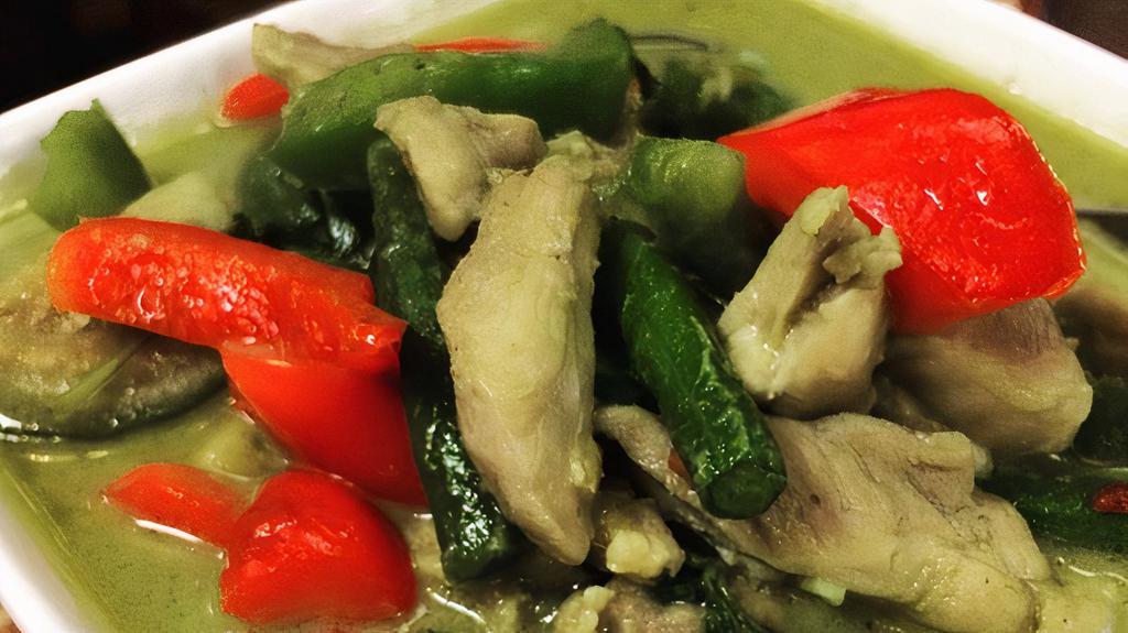 Green Curry · Green coconut curry prepared with green beans, Thai eggplant, bell peppers, and basil leaves.