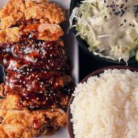 *Sesame Chicken · Crispy battered chicken thigh meat, sesame seeds, teriyaki glaze, cabbage salad, house sesam...