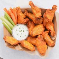 12 Classic Bone-In Wings · 12 Classic bone-in chicken wings tossed in up to 2 wing flavors and served with fresh carrot...