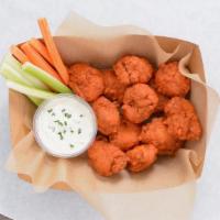 12 Crispy Boneless Wings · 12 Crispy boneless chicken wings tossed with up to 2 wing flavors and served with fresh carr...