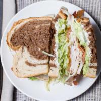 Turkey Supreme Sandwich · With avocado and bacon.