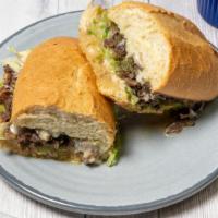 Philly Cheesesteak Sandwich · With provolone cheese on French roll.