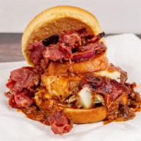 Chili Cheese Pastrami Fries · Fried potatoes topped with cheese, pastrami and chili.