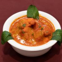 Chicken Tikka Masala · Chicken cooked in a tomato based creamy sauce.