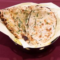 Garlic Naan · Leavened flour bread garnished with garlic.