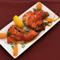 Chicken Tandoori · Grilled chicken marinated in yogurt and spices.