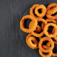 Onion Rings · Thick cut onion rings are made from whole white onions, battered with a subtle blend of spic...
