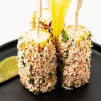 Street Corn · grilled corn on the cob, coated with a four chilli aioli, rolled in choice of follow your he...