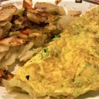Veggie Omelette · Four whipped eggs mixed with fresh chopped vegetables, then rolled together into a fully ome...