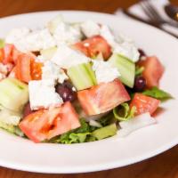 Greek Salad · Cucumber, fresh lettuce, tomatoes, onions, Greek feta cheese, kalamata olives tossed with ou...