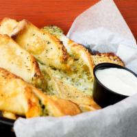 Pesto Twists · Twists with fresh made pesto, shaved Parmesan and shredded mozzarella. Served with house mad...