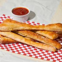 Bread Sticks · 8 pieces baked bread sticks with side of marinara sauce.