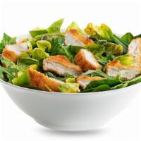 Crispy Chicken Salad · Fresh salad made with crispy chicken strips, tomatoes, olives, and red cabbage over a bed of...
