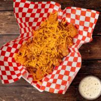 Chili Cheese Tots · Large basket of Tots with no bean chili and shredded cheddar cheese