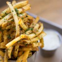 Herb Truffle & Parmesan Fries · Drizzled with truffle oil, herbs, and topped with parmesan cheese.