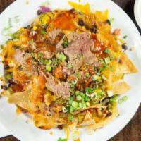 Bbq Nachos · 4 generous portions of homemade chips with jack & cheddar cheese, grilled corn, green onions...