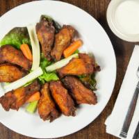 Wagon Wheel Of Wings · More than a pound of smoked wings with dry rub. Add spicy bbq sauce. Served with ranch dress...