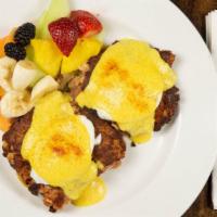 Corned Beef Hash Benedict · Corned beef hash with 2 poached eggs on an english muffin, topped with Hollandaise sauce