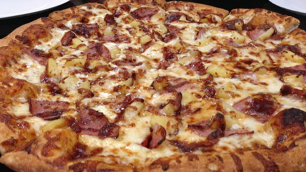 Bbq Chicken Pizza · Our House-made Pizza Dough topped with BBQ Sauce, a Mozzarella and Cheddar Cheese blend, BBQ Chicken, Red Onion, Cilantro, and Parmesan Cheese.