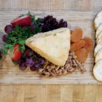 Warm Baked Brie · Warm Baked Brie with crackers, nuts, fruit, and honey