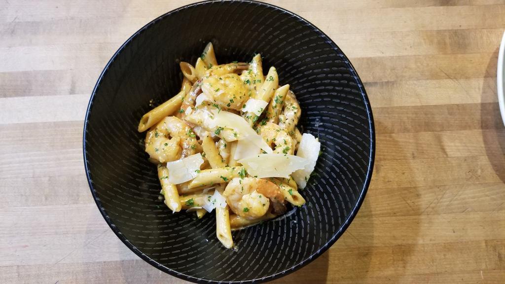Cajun Shrimp And Chicken Pasta · sauteed shrimp and grilled chicken over penne pasta tossed in cajun garlic butter sauce