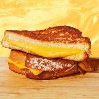 Classic Grilled Cheese · Melted american cheese between two slices of buttery grilled bread.