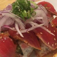 Kiss Of Fire Roll · Spicy tuna, fresh jalapeno, cucumber and avocado inside, Cajun peppered seared ahi tuna on t...