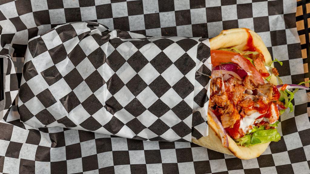Mf Chicken Gyro · Perfectly seasoned chicken with onions tomatoes and cilantro, wrapped in a warm authentic pita bread. With your choice of sauces. (Originally comes with in house white sauce)