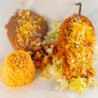 Chile Relleno · Homemade Chile Relleno in Ranchero Sauce-Cheese & Pico De Gallo, Rice & Beans Sides.