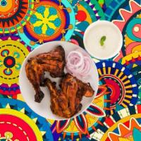 Char Grilled Tandoori Chicken · Bone-in chicken marinated in yogurt and house spices cooked to perfection in an Indian clay ...