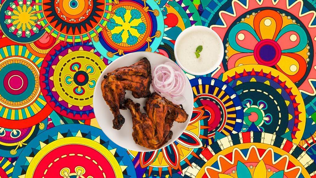 Char Grilled Tandoori Chicken (Half) · Bone-in chicken marinated in yogurt and house spices cooked to perfection in an Indian clay oven. Served with a side of fresh mint relish.