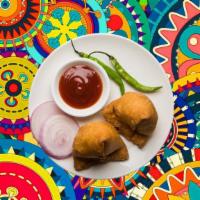 Samosa Surprise  · Triangle shaped deep fried pastry dumplings filled with spiced potatoes and vegetables