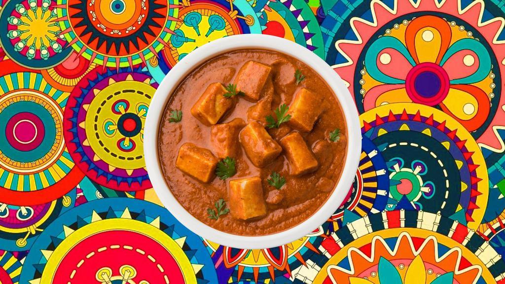 Awadhi Butter Paneer · Char grilled cottage cheese cubes, cooked to perfection in a tomato cream sauce, served with a side of our aromatic basmati rice