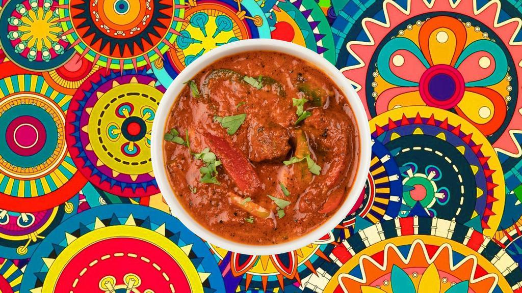 Coastal Lamb Vindaloo · A special from the coastal state of Goa, boneless chunks of lamb, slow cooked in a hot and tangy  traditional red 'rechado' masala, served with a side of our aromatic basmati rice