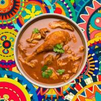 Homestyle Chicken Curry · Tender morsels of chicken cooked in a classic brown curry with Indian whole spices, served w...