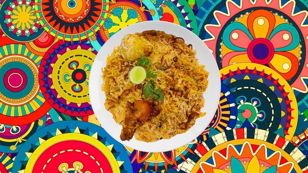 Awadhi Chicken Biryani · Succulent chunks of chicken cooked with our signature biryani masala gravy and long grain premium basmati rice