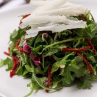 Insalata Di Campo · What's good. Arugula, radicchio salad with sun-dried tomatoes and shaved parmigiano in lemon...