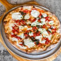 Margarita Pizza · With fresh mozzarella, basil and olive oil. Choice of red or white tomato pie style or pizza...