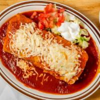 Wet Burrito · Choice of steak, chicken or carnitas with beans, rice, cilantro, onions, and choice of sauce.