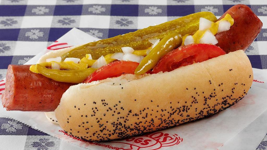Char Grilled Polish Sausage Sandwich · Char grilled polish sausage, made like our Chicago Style Hot Dog everything includes mustard, celery salt, freshly chopped onions, sliced red ripe tomatoes, kosher pickle, and sport peppers piled onto a steamed poppy seed bun..