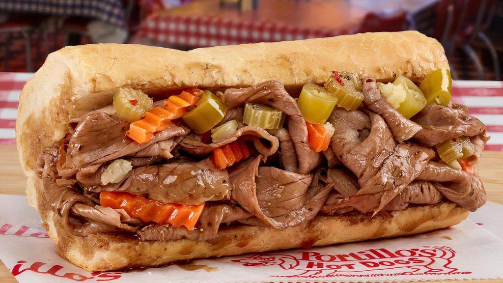 Italian Beef Sandwich · Our famous, homemade, Italian beef is slow-roasted for four hours, thinly sliced, and served on freshly baked Turano French bread. . Best served with home-cooked sweet peppers and/or hot giardiniera peppers (pictured) for an extra charge.. Served regular-sized or as a Big Beef (50% bigger). .