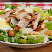 Caesar Salad · Everything includes a crispy bed of romaine lettuce topped with a hardboiled egg, croutons, ...