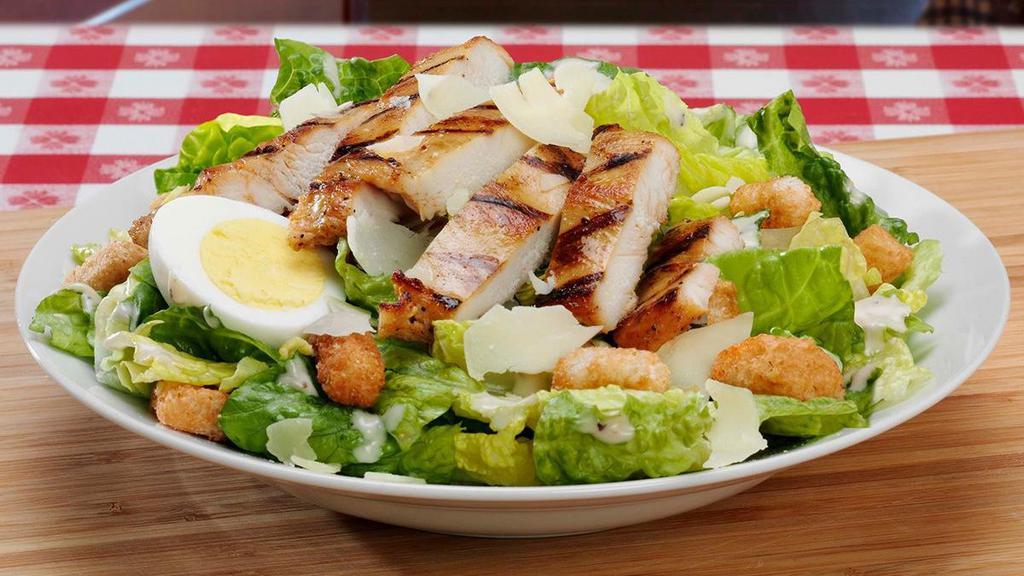 Caesar Salad · Everything includes a crispy bed of romaine lettuce topped with a hardboiled egg, croutons, and freshly grated parmesan cheese. Caesar dressing served on the side.